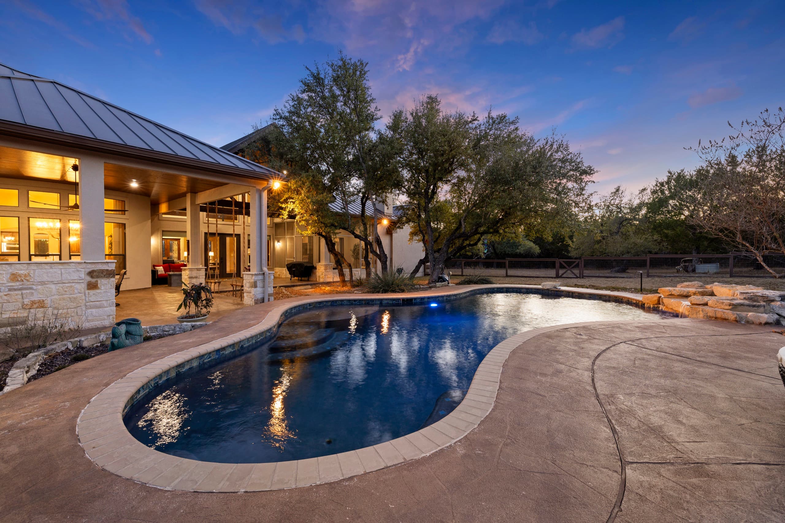 Twilight pool and patio at a Texas Hill Country home